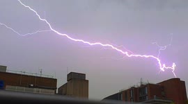 Thunderstorms and downpour as lightning streaks across London sky