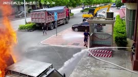 Burning truck extinguished after motorist drives it into fire station in China