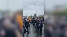 UK pupils walk out after girl with disease which means hair falls out was banned from wearing caps