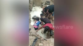 Plumber rescued after being submerged in muddy drain