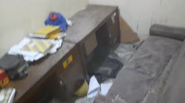 A one meter long monitor lizard destroys a room at the Jatinegara police station, East Jakarta, Indonesia