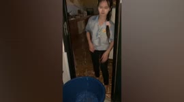 Heavy rain from thunderstorm pours into woman’s home in Thailand