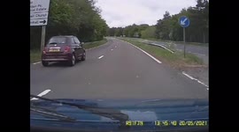 Near miss - caravan pulls out in front of rover metro on the A12