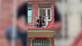 Man struggles to remove head stuck between metal bars