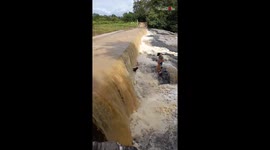 'Courageous Man Rescues Dog Trapped in the Middle of a Waterfall'