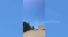 Filipino workers hide in shelter during rocket bombardment in Israel