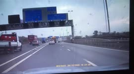 A foreign articulated lorry cuts across 3 lanes of the M42 totally disregarding oncoming traffic