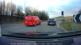 Car incorrectly tries to escape from roundabout and makes close call, dangerous situation with another car
