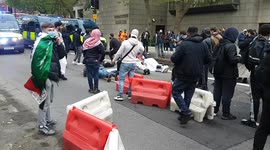 Two youths do press-up challenge moments before police move in to kettle protesters at Palestine demonstration in London