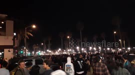 Absolute mayhem in downtown Huntington Beach police on scene with tear gas