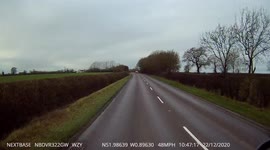 Close overtake on the A421 in poor weather conditions in Bucks UK