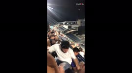 Drunk guy tries to twerk at concert and falls over backwards