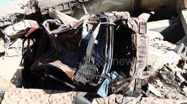 Palestinian man, Nazmy al-Dahdouh, 70, sits in a makeshift tent that he has set up on top of the rubble of his home.