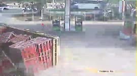 Truck topples over after pulling into gas station