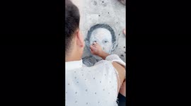 Chinese man draws charcoal portrait in memory of 'father of hybrid rice'