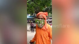 Indian man wears face mask made from leaves believing it will protect him from Covid-19
