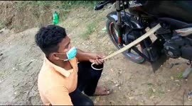 Motorcycle rider finds deadly cobra hiding under his seat in India