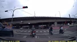 Truck topples over inches from motorcycle riders in Taiwan