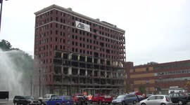 Crowd scatters as Pennsylvania building demolition goes off 150 feet away