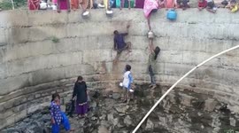 Indian villagers form human chain to reach water in 20-feet-deep well