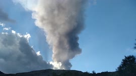 Heavy ash and lapilli rain from the sky during last eruption of Etna volcano in Sicily.