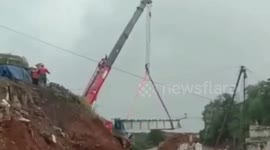 Crane tumbles down in Indonesia