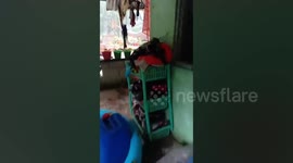 Floods surge through homes in the Philippines during Typhoon Choi-wan