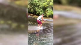 Brazilian adrenaline junkie performs an epic surf trick on a waterfall - WITHOUT A SURFBOARD