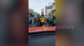 Road rage motorcycle riders have punch-up in the middle of busy road