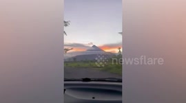 Spectacular UFO cloud formation forms over mountain in the Philippines