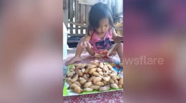 One-year-old girl devours live worms like it is candy