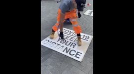 'Vaguely Satisfying Footage of a 'COVID-19' Road Marking Being Applied'