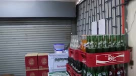 Wild monitor lizard caught rampaging through shop in Thailand