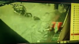 CCTV camera has captured the moment when two women escaped narrowly after falling into an open manhole in Western India