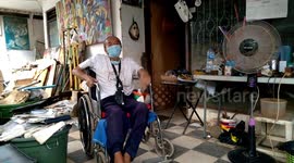 Indonesian artist on a wheelchair shares a story of his paintings being stolen