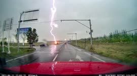 Motorist's dashcam captures intense lightning strike nearby road in China