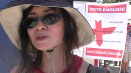 A Chinese woman protests against human rights abuses and imprisonment of British government Julian Assange for telling the truth