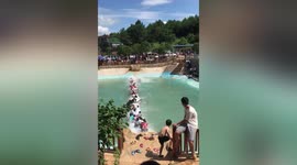 Over 20 tourists fall into water after swinging bridge breaks in southern China