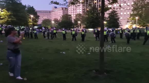 Riot police at the London eye breaking up crowds with force