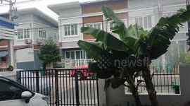 Rocket man drives along a street in Thailand spraying a bacteria killing sanitizer in the air.