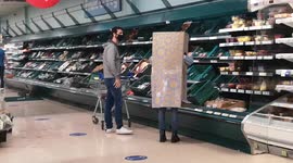 Cardboard garb: Pandemic protection reaches new levels with grocery shopper