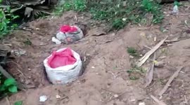 Officials destroy 5000 liters of illicit alcohol near embankment pond in southern India