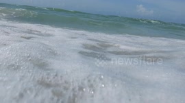The waves crashing onto the beach at Sanibel Beach Sanibel Island