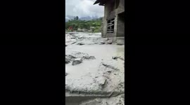 Local resident shows devastated house and farm after landslide in Nepal village