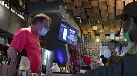 Indonesian officials raid Jakarta bar, resulting in stand-off with angry foreign owner