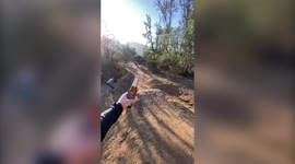 Insane moment professional US bike rider takes lid of bottle of beer using WHEEL