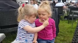 Toddlers putting lip gloss on one another at Cheshire show.