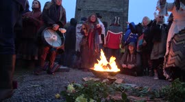 Daybreak celebrations at Glastonbury Tor summer solstice in spite of the overcast weather