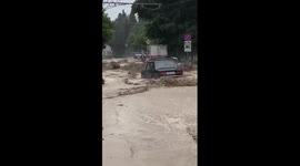 Rapid floodwater rushes through streets of Crimea