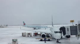 Plane Gets Blown Away From Its Gate Due To Strong Winds & An Icy Runway